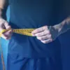 Man measuring waist