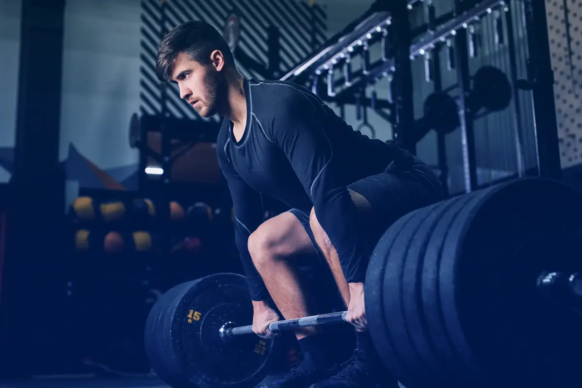 Man deadlifting