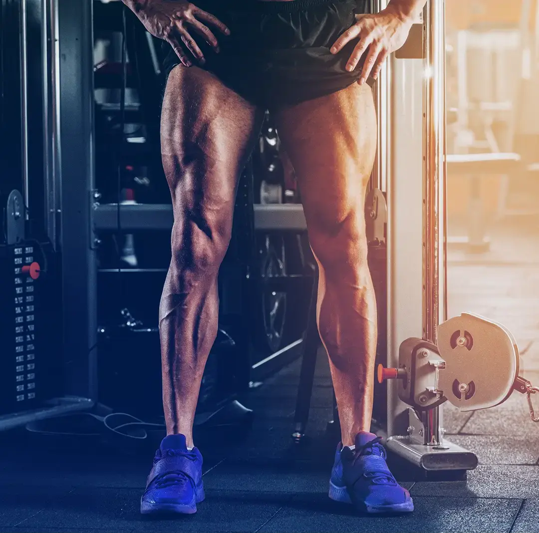 man flexing leg muscles