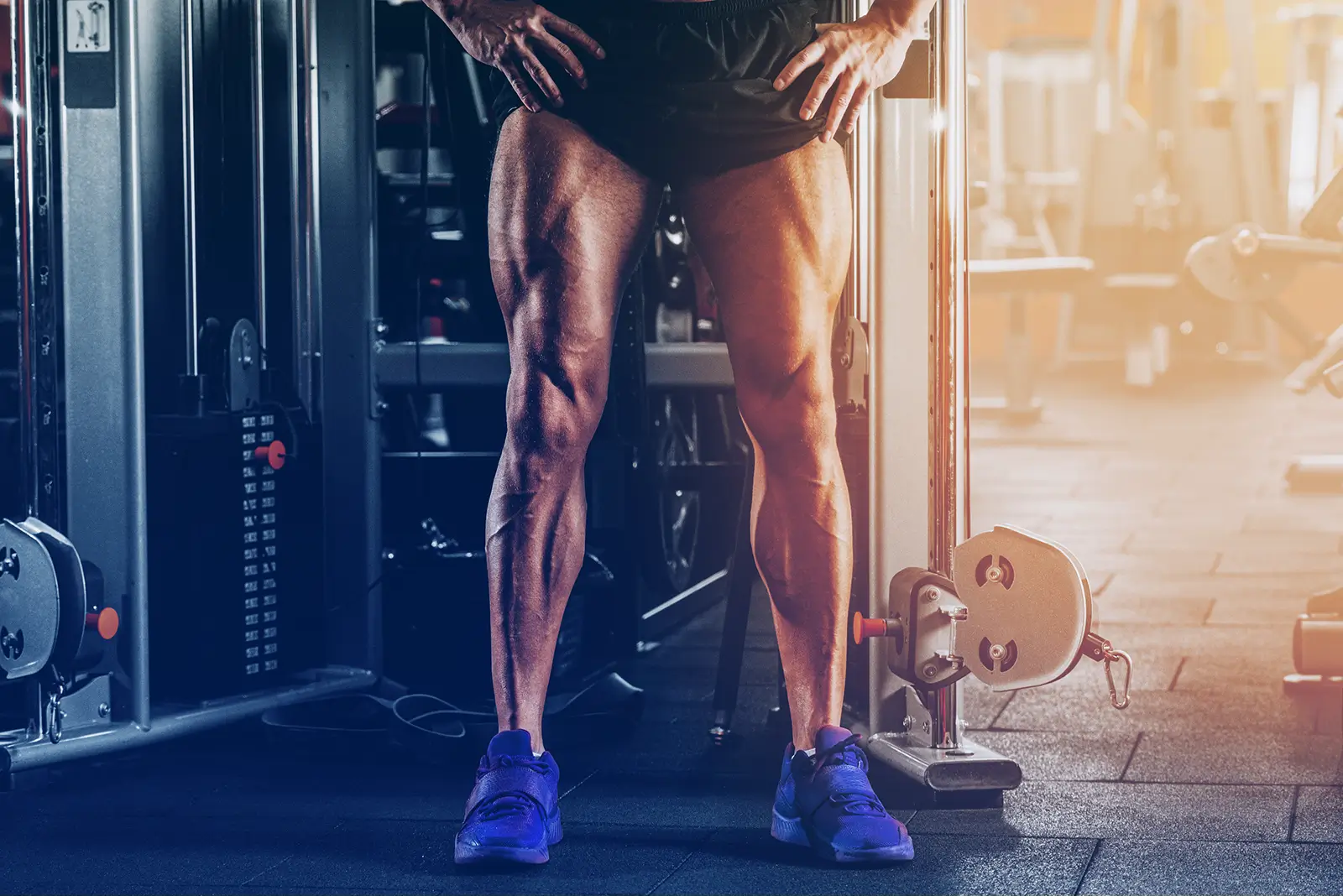 man flexing leg muscles