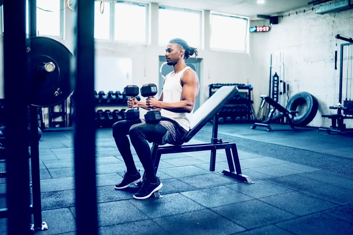 man about to lift dumbells