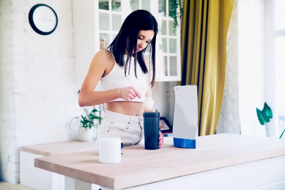 woman making a protein shake