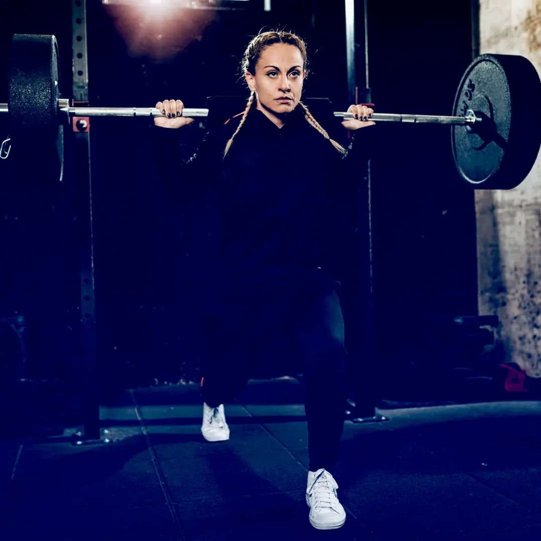 woman doing split squats