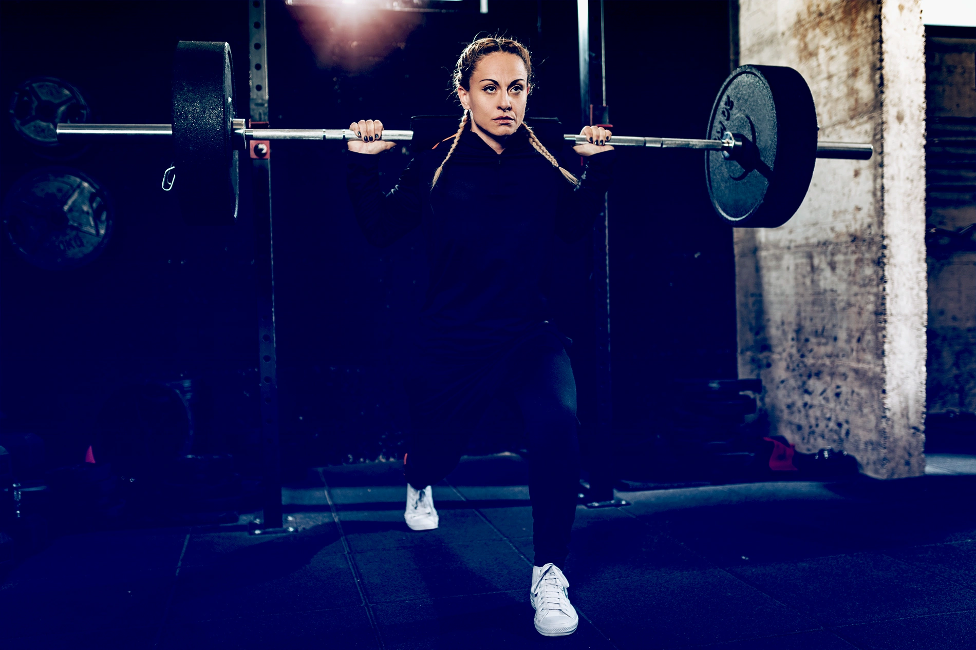 woman doing split squats