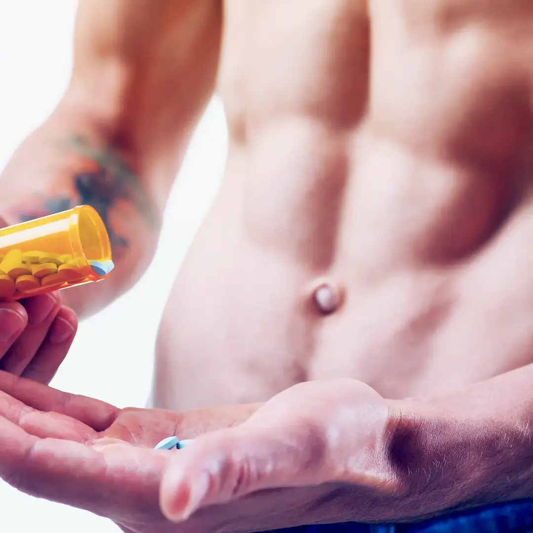 shirtless man taking NSAIDs