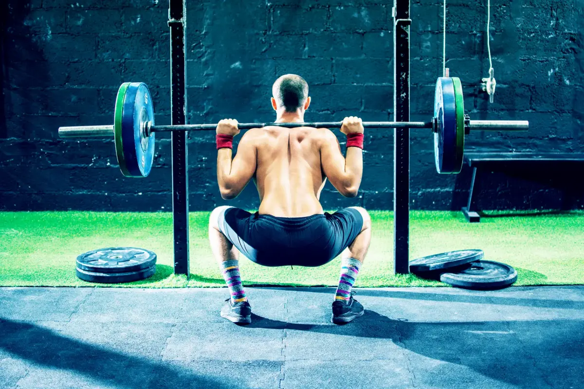 man doing backsquats