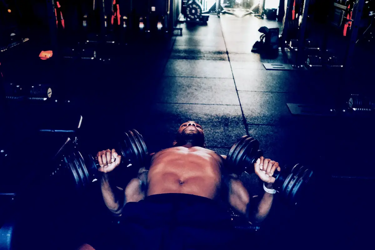 man doing dumbell press