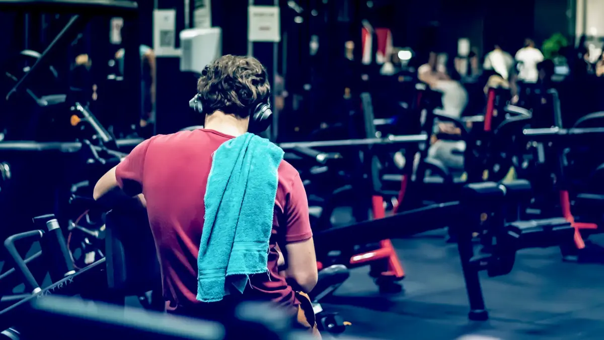 man resting in gym