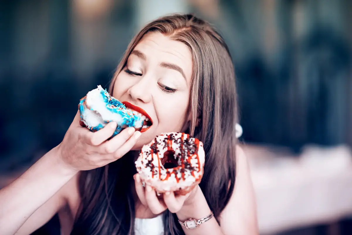 woman eating donuts