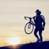 man carrying a bike