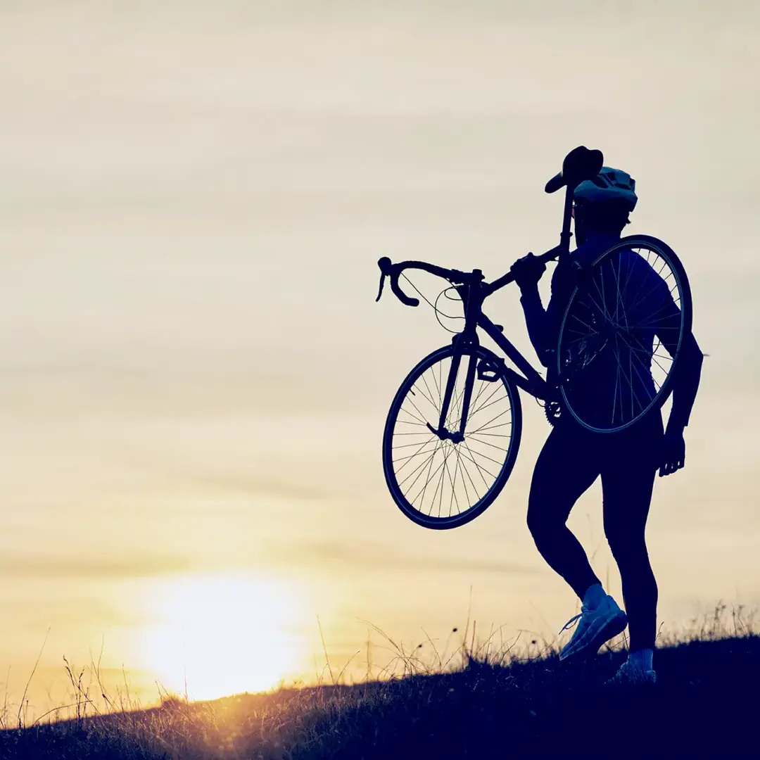 man carrying a bike
