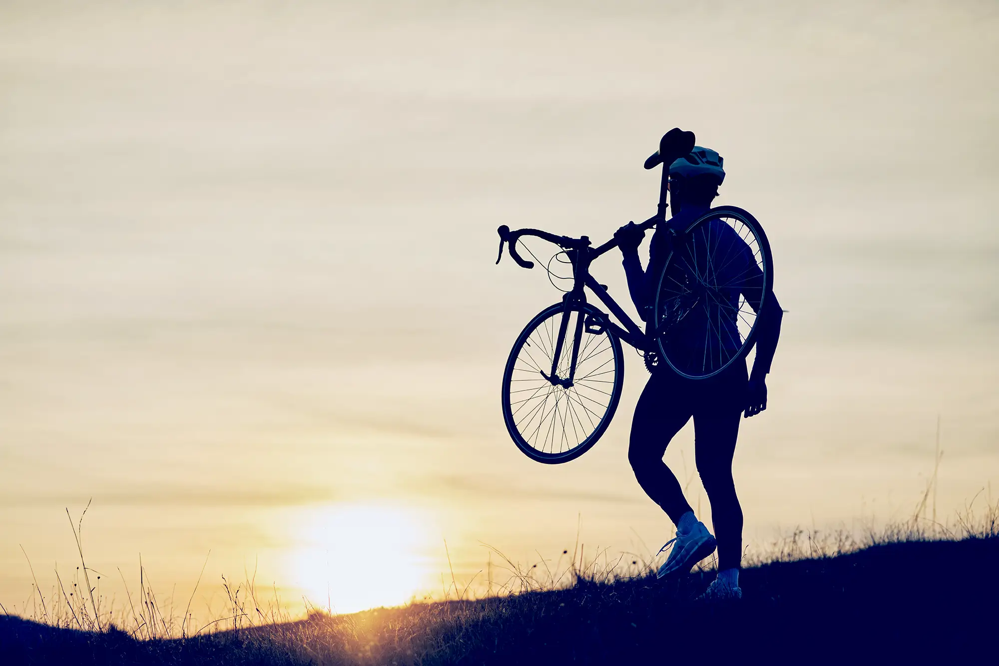 man carrying a bike