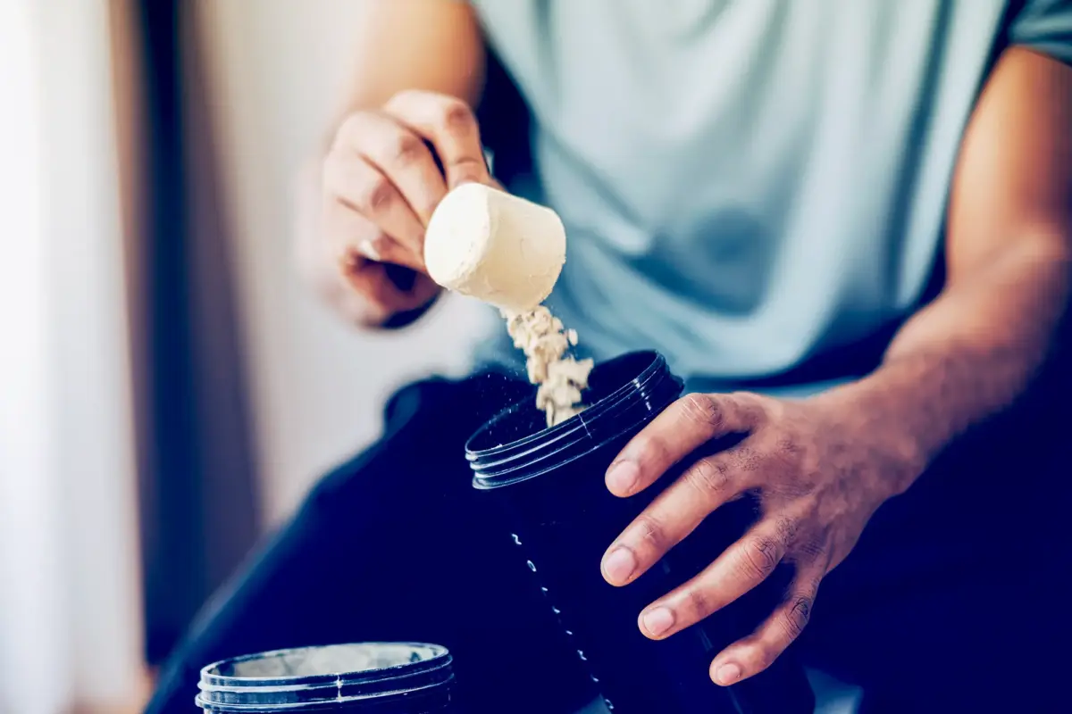 man taking protein powder