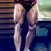 man flexing quads