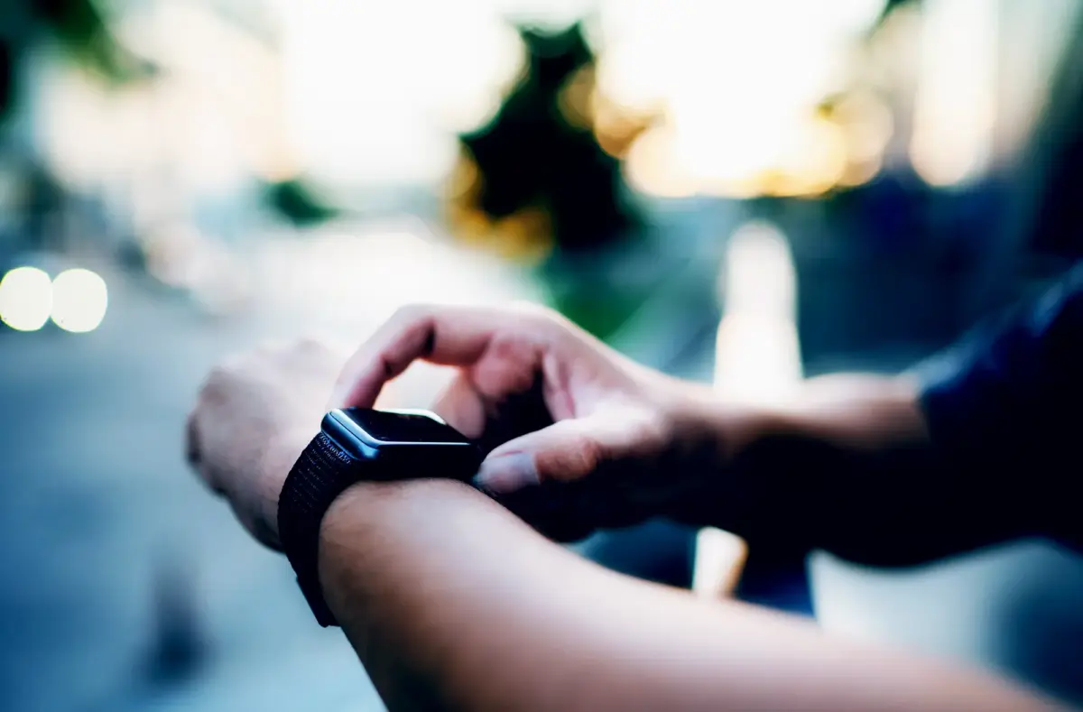someone checking their smartwatch