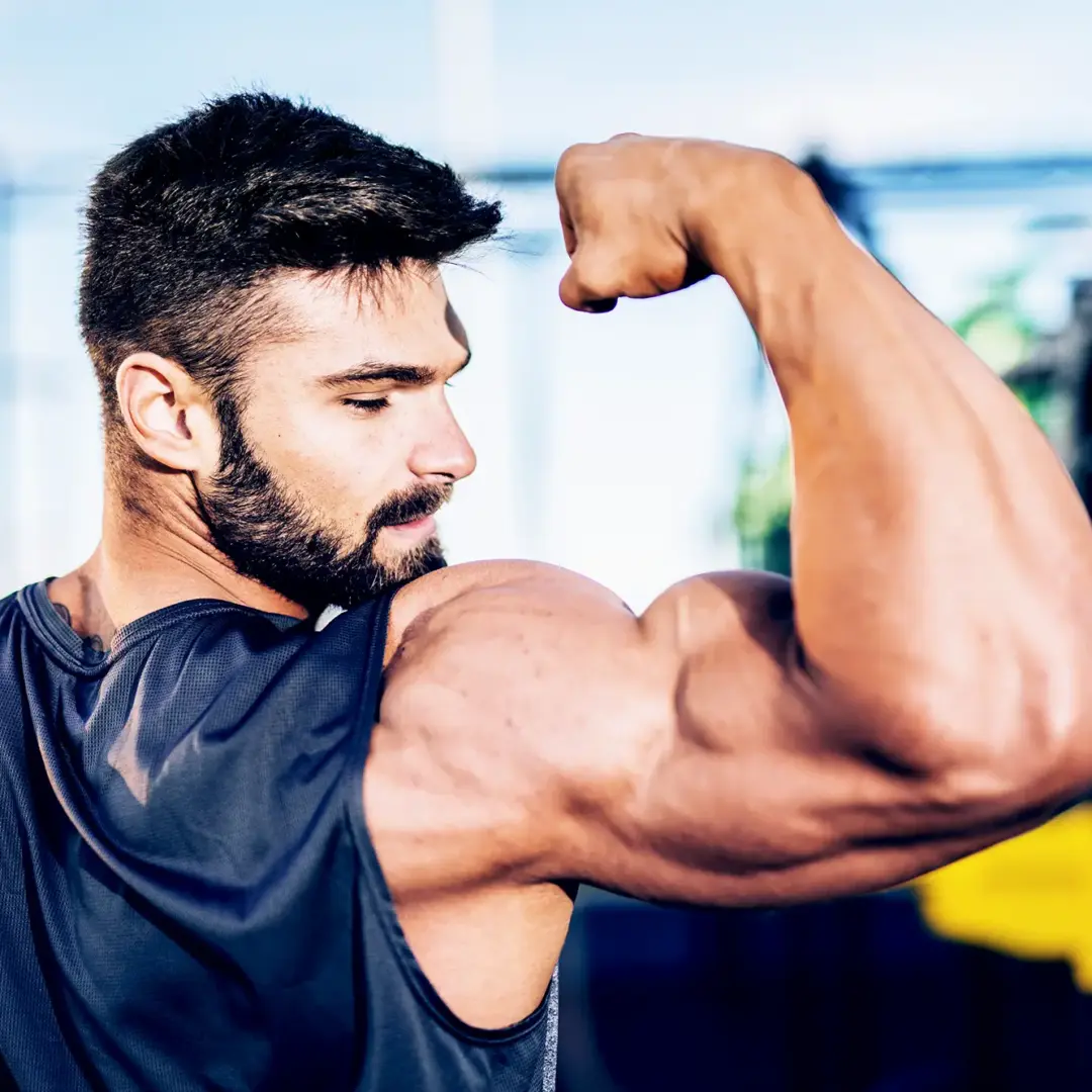 man flexing bicep