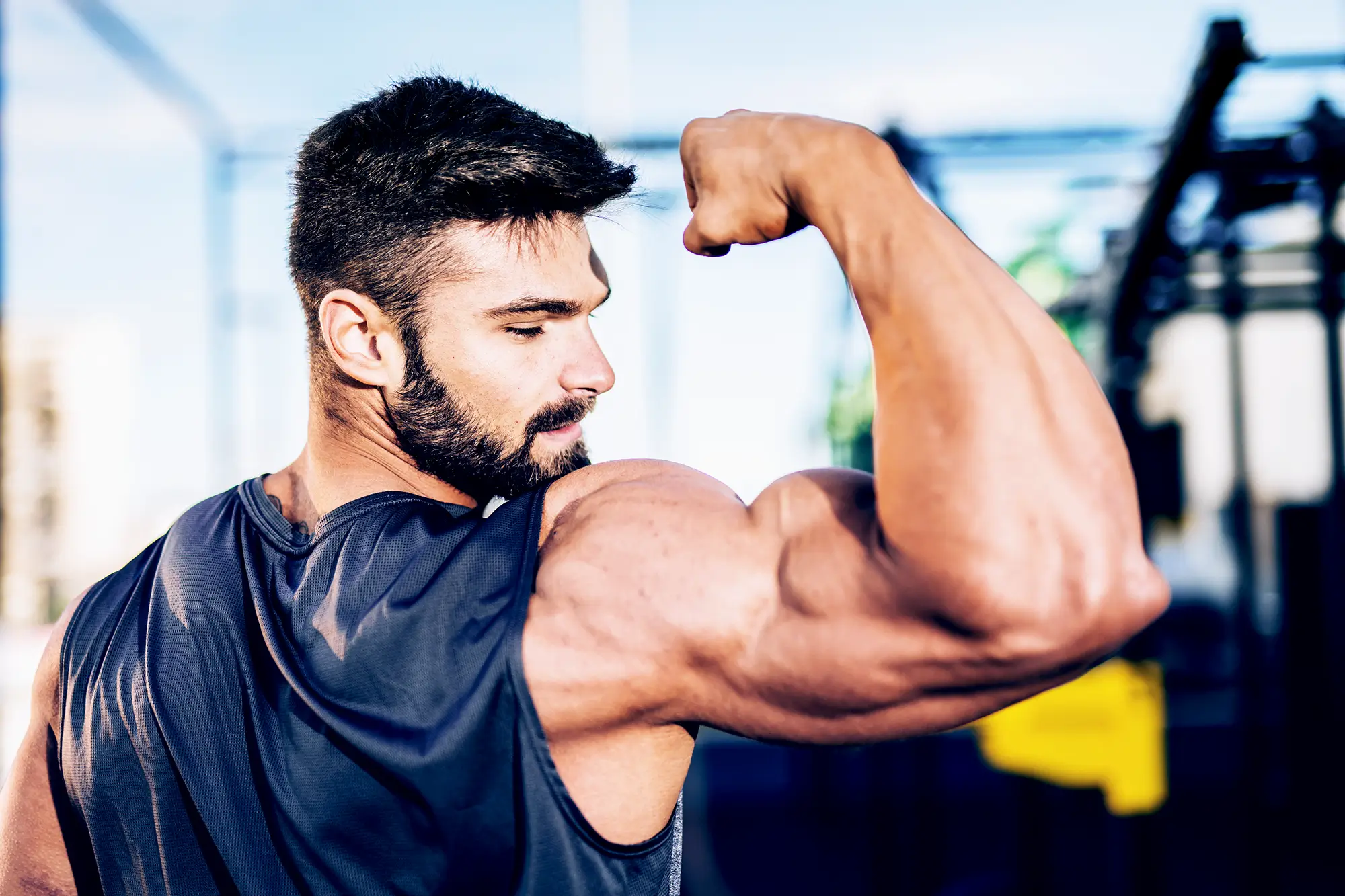 man flexing bicep